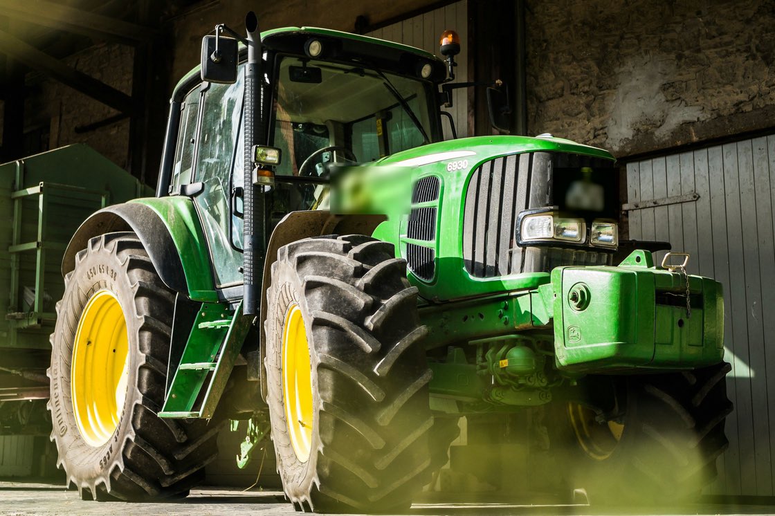 Farm tractor used for agricultural work.